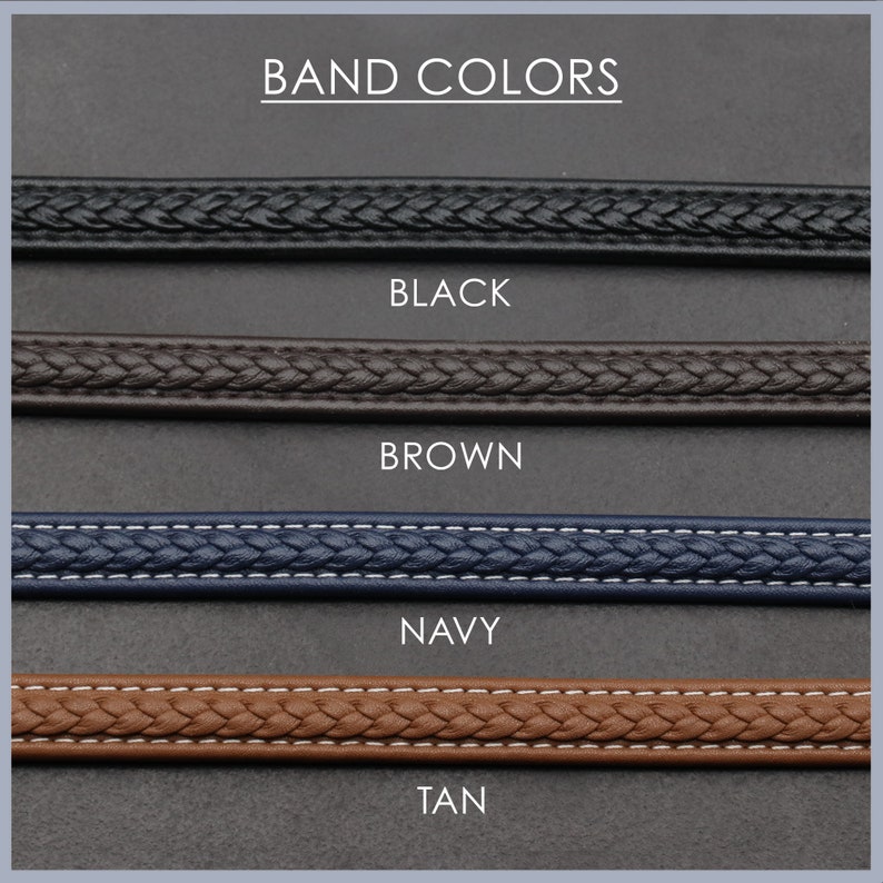 May include: Four different coloured watch bands: black, brown, navy, and tan. The bands are all braided and have a stitched edge.