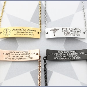 May include: Four gold, silver, and black medical alert necklaces with engraved plates. The plates include medical information such as "Natalie Peers Alzheimers ICE:123.456.7890" and "TYPE 1 DIABETIC INSULIN PEN IN BAG LATEX ALLERGY ICE:123-456-7890". The back of the plates have the text "BACK ENGRAVING 4 LINES OF YOUR INFORMATION 25 CHARACTERS MAX MORE INFO=SMALLER FONT".