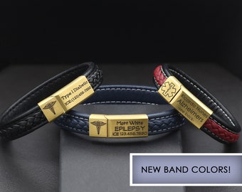 May include: Three leather bracelets with gold medical alert tags. The black bracelet says "Type 1 Diabetic ICE:(123)486-7890". The blue bracelet says "Matt White EPILEPSY ICE 123.456.7890". The red bracelet says "Ricardo Nunes Alzheimers -see back-".