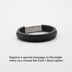 May include: Black leather bracelet with a braided design and a silver metal plate engraved with the text "Loved you than, Love you always. 01/01/2021" and the initials "AK + MK".