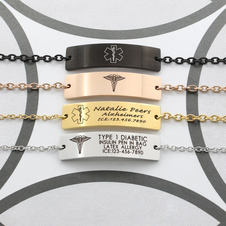 May include: Four different medical alert bracelets with black, rose gold, gold, and silver chains. The bracelets have engraved medical information, including the name "Natalie Peers", the condition "Alzheimers", and the ICE number "123-456-7890". Another bracelet has the text "Type 1 Diabetic, Insulin Pen in Bag, Latex Allergy" and the ICE number "123-456-7890".