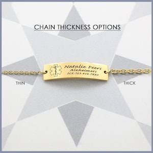 May include: Gold medical ID bracelet with a chain. The tag reads "Natalie Peers Alzheimers ICE: 123.456.7890". The chain is shown in two thicknesses: thin and thick.