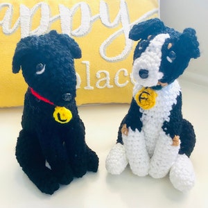 May include: Two crocheted dog toys, one black with a red collar and a yellow letter U, the other black and white with a yellow letter A.