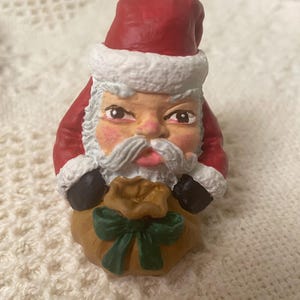 Hand painted ceramic Santa Claus Figurine with toy sack