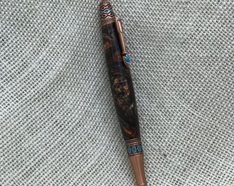 Santa Fe style custom pen. Finished in copper hardware with ornate detail.  Black gel ink, replaceable cartridge.