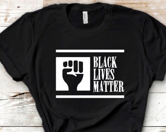 May include: Black t-shirt with a white raised fist and the text "Black Lives Matter" in a white box.