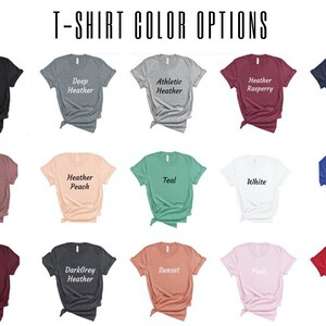 May include: A selection of t-shirt colors, including black, deep heather, athletic heather, heather raspberry, heather navy, heather mauve, heather peach, teal, white, heather true royal, maroon, dark grey heather, sunset, pink, and red.
