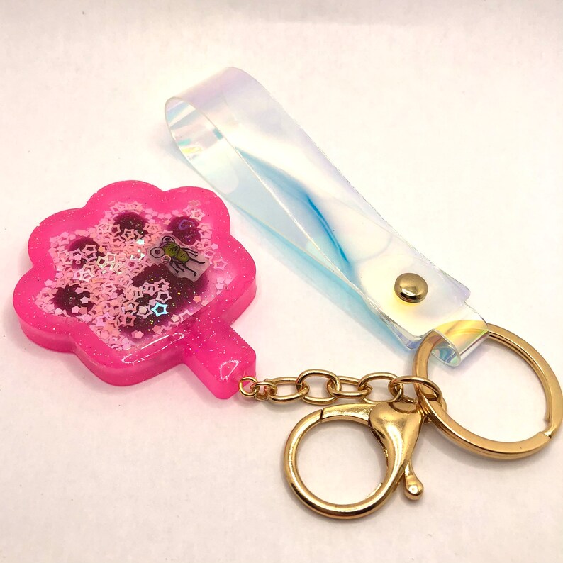 Pink cat paw resin shaker with bug purse charm with key ring with iridescent handle Keychain Bag charm Zipper pull Shaker cat paw