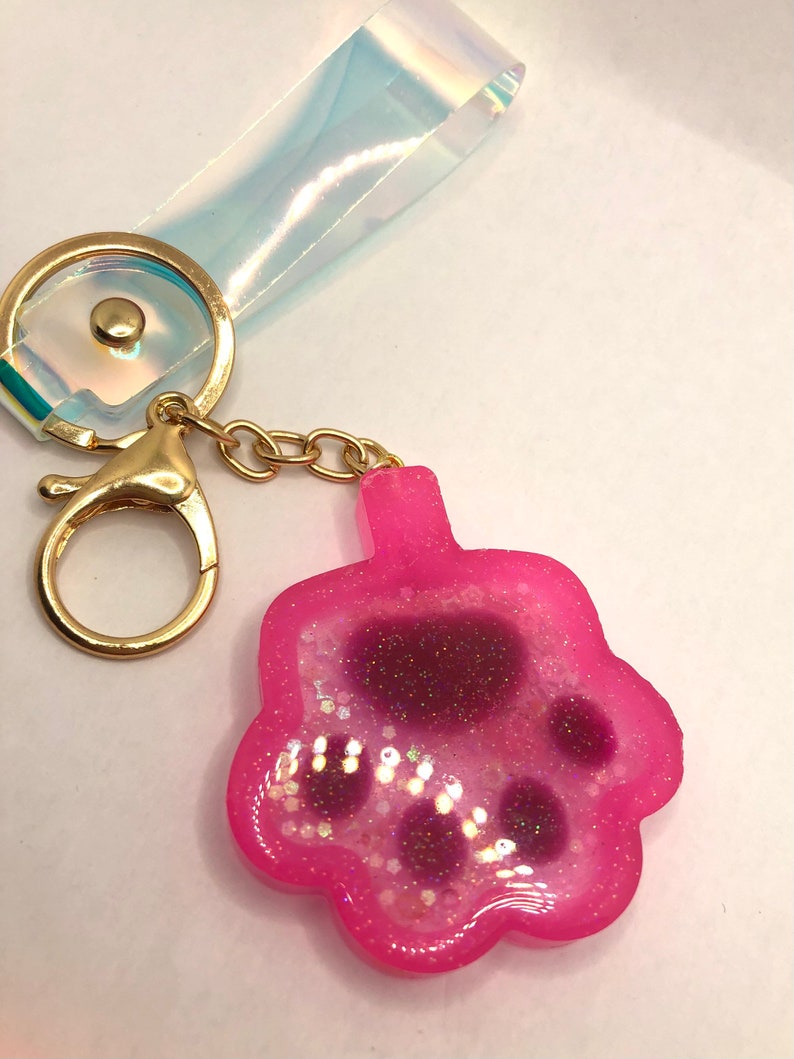 Pink cat paw resin shaker with bug purse charm with key ring with iridescent handle Keychain Bag charm Zipper pull Shaker cat paw