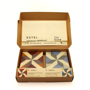 Gift box with two decorative soaps infused with essential oils. Orange and lime soap and eucalyptus, rosemary, and lavender soap. Mosaic image.