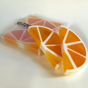 Handmade soap with orange and cedar essential oils. Soap in the shape of an orange slice for bathroom decoration. Totsabo citrus aroma