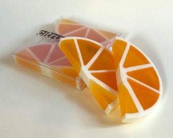 Handmade soap with orange and cedar essential oils. Soap in the shape of an orange slice for bathroom decoration. Totsabo citrus aroma