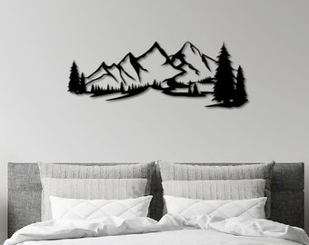 May include: Black metal wall art depicting a mountain range with trees in the foreground. The art is mounted on a white wall above a bed with gray and white bedding.