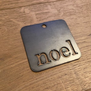 Noel Christmas Metal Ornament - Handcrafted Holiday Decor - Rustic Xmas Tree Decoration - Festive Seasonal Hanging - Unique Gift Idea