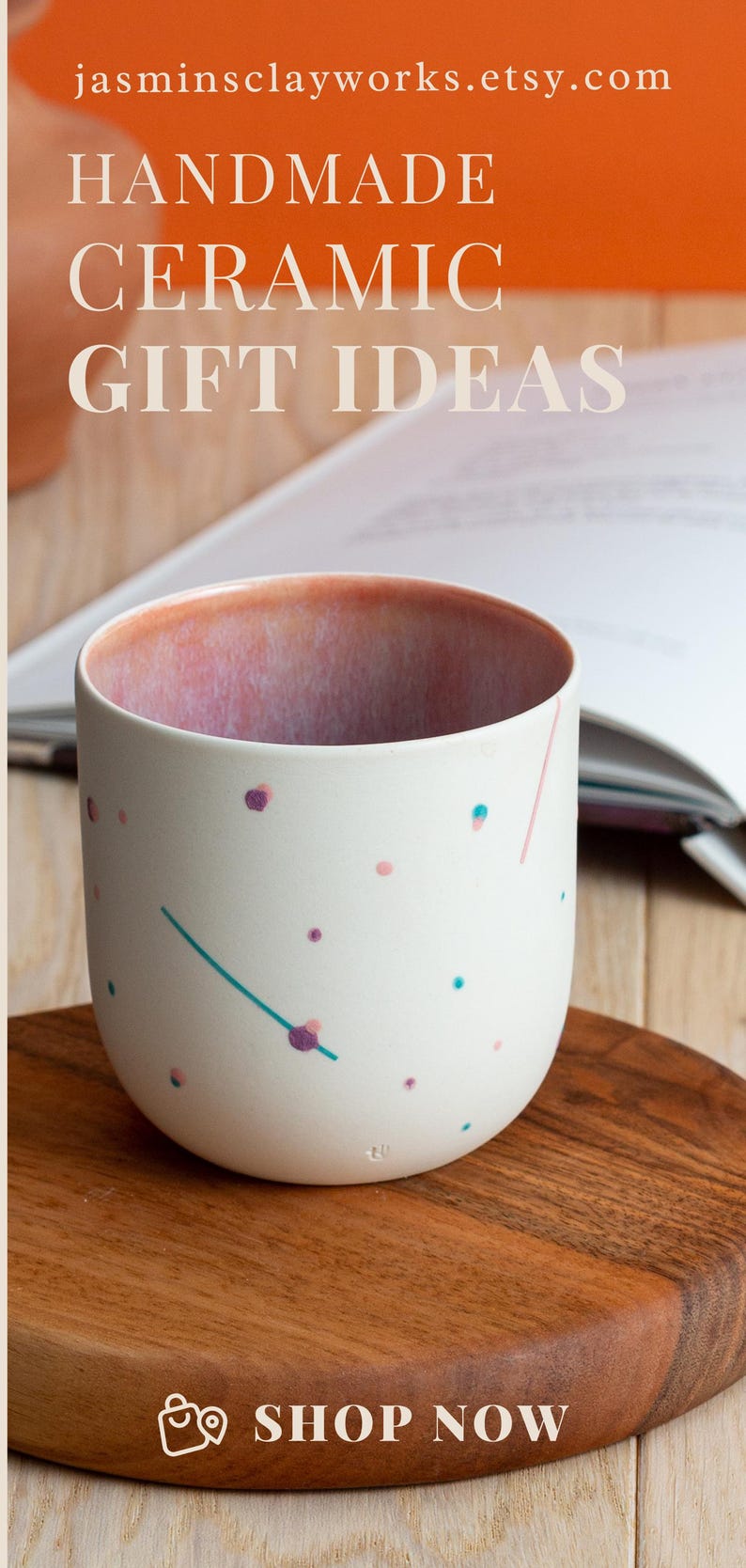 May include: A white ceramic mug with a pink, blue, and purple speckled design. The mug is sitting on a wooden surface. "SHOP NOW" is written in white text on a brown background.