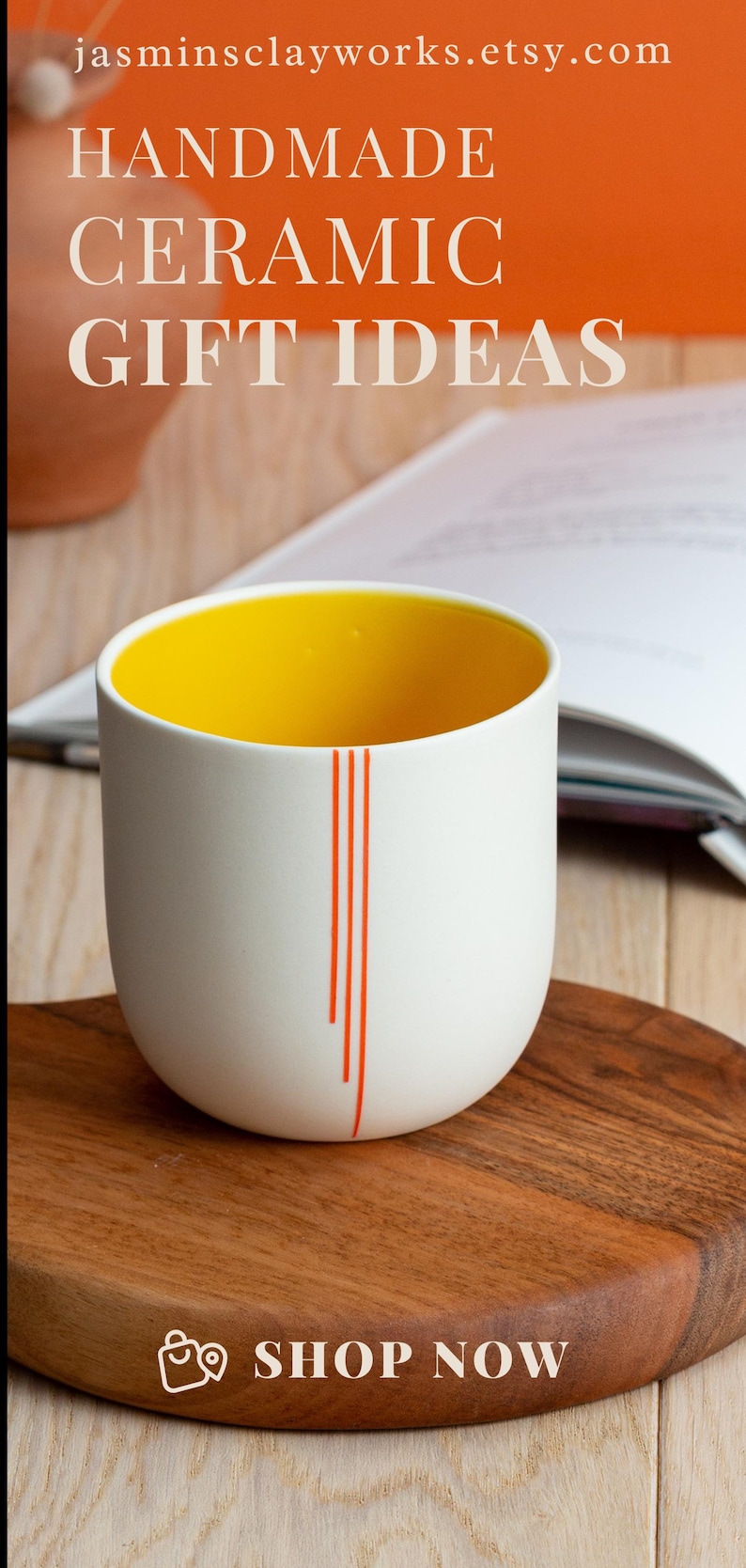 May include: A white ceramic mug with a yellow interior and orange stripes. The mug is sitting on a wooden surface. "SHOP NOW" is written on the surface.
