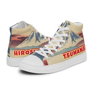 May include: White high-top canvas sneakers with a print of a Japanese mountain scene and the text "HIROSHI" and "TSUMAN88" in red.