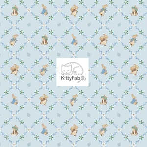 May include: Light blue fabric with a repeating pattern of bunnies and squirrels in clothing, interspersed with floral and vine designs. The fabric has a diamond grid pattern. The KittyFab logo is in the center.