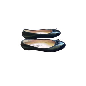 May include: A pair of black leather ballet flats with a black patent leather toe cap and a bow detail. The flats are by the brand "Paul Mayer Attitudes".