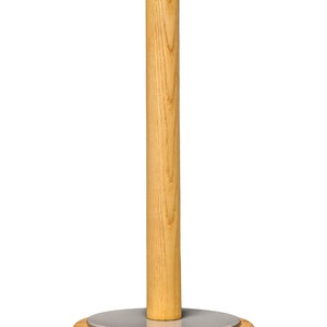 May include: A wooden paper towel holder with a gray metal base. The holder is made of natural wood with a light brown finish.