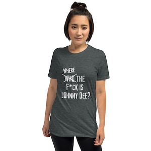 May include: A dark heather grey t-shirt with a white graphic that says "Where the F*ck is Johnny Dee?" The word "Who" is crossed out.