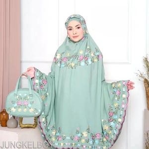 May include: A mint green prayer garment set with floral embroidery in pink, yellow, and blue. The set includes a matching handbag with similar floral detailing. The text "JUNGKELBOY" is visible at the bottom of the image.