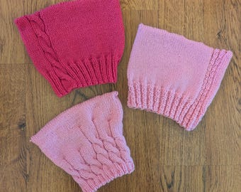 Cable-knitted Pink Pussy Hat, mulesing-free wool