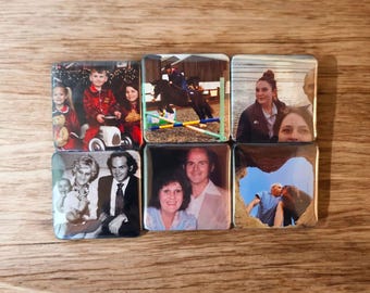May include: A set of six square photo magnets featuring various family photos. The photos include a family portrait, a child in a red shirt, a woman riding a horse, a woman in a blue jacket, a couple, and a couple kissing.
