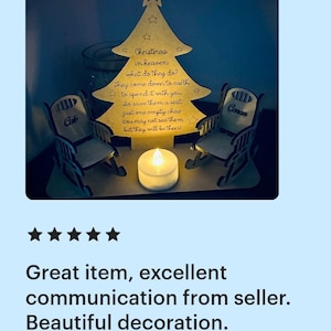 Puede incluir: Un adorno de &aacute;rbol de Navidad de madera con dos mecedoras y una vela. El &aacute;rbol tiene el texto "Christmas in heaven what do they do? They come down to earth to spend it with you So save them a seat just one empty chair You may not see them but they will be there!" Las sillas est&aacute;n etiquetadas "Cole" y "Conan".
