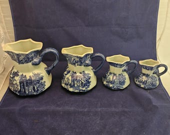 Set of 4 Graduated Victoria Ware Ironstone Flow Blue Reproduction Pitchers