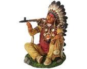 ネイティブアメリカンのインディアン酋長が平和のパイプを吸う像