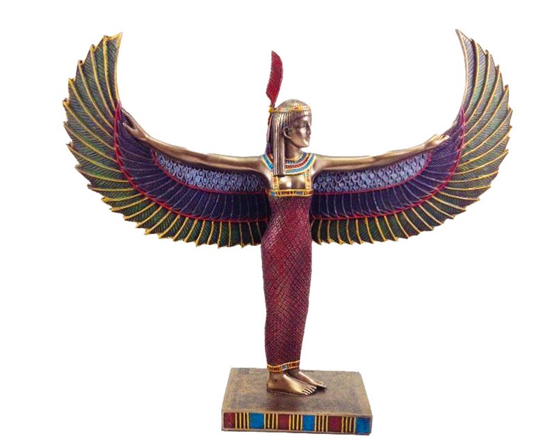 May include: A gold and red statue of the Egyptian goddess Isis with outstretched wings. The statue is standing on a base with blue and gold accents.