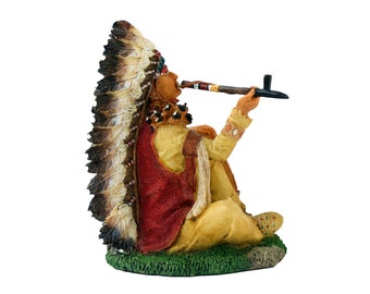 ネイティブアメリカンのインディアン酋長が平和のパイプを吸う像