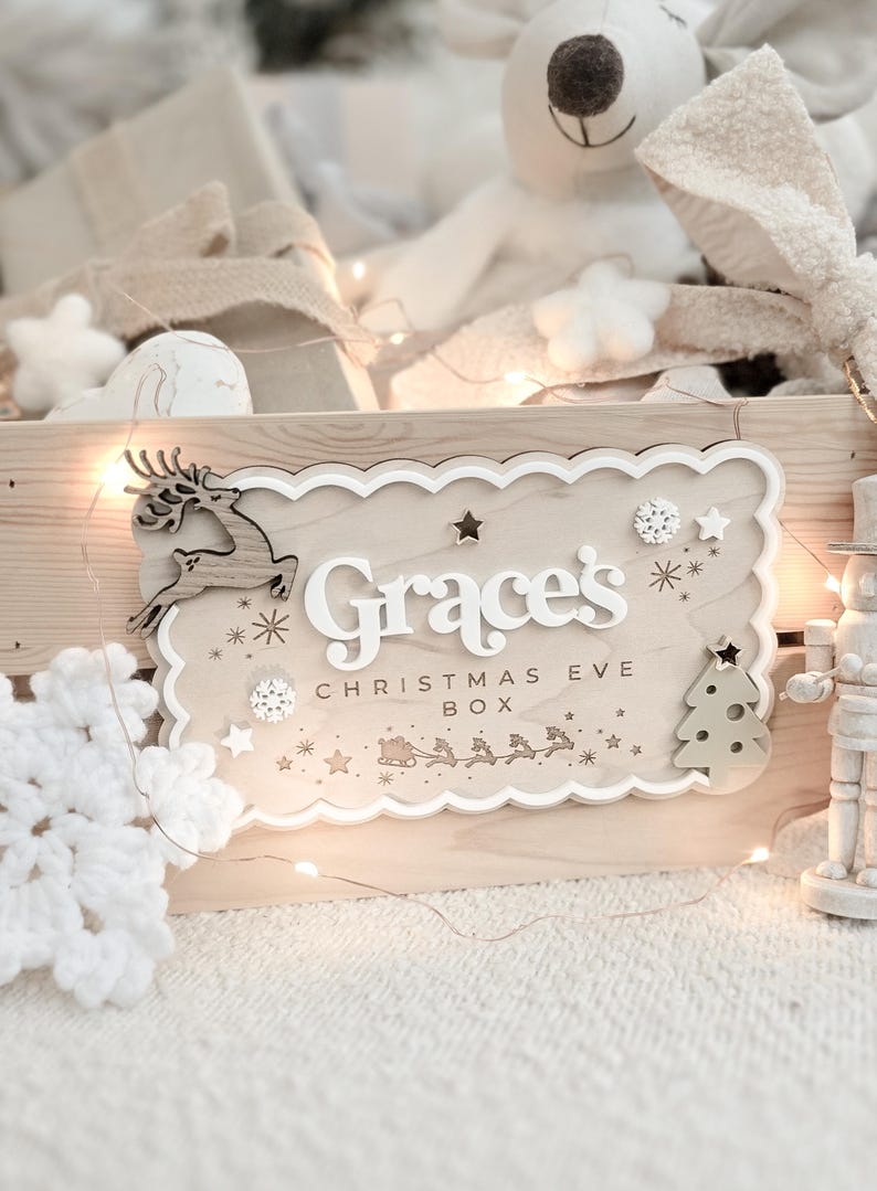 Personalised wooden Christmas crate with 3D white acrylic name plaque, sage green tree, oak reindeer, and festive details – ideal for Christmas Eve or advent gifts.