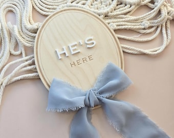 He’s Here Baby Announcement Plaque – Oval Newborn Sign with 3D or Engraved Text | Gender Reveal | Simple Wooden Flatlay Prop WORLDWIDE