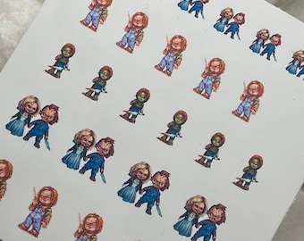May include: A sheet of nail art stickers featuring various images of the fictional characters Chucky and Tiffany from the horror film franchise Child's Play. The stickers feature the characters in various poses, including holding knives and standing together.