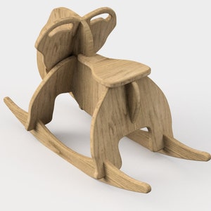 May include: A wooden rocking horse toy with a natural finish. The horse has a saddle and a head with ears.