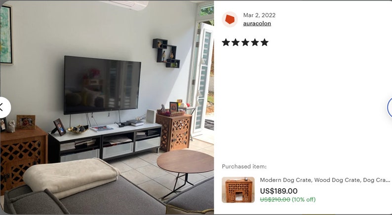 May include: A wooden dog crate featuring a square lattice pattern on the side panels and a rectangular front opening. The crate is constructed from brown wood and includes a flat top surface, providing a functional enclosure for a pet.