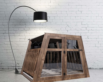 May include: A wooden pet crate with a trapezoidal frame, featuring a front door with a black latch, clear glass panels, and vertical wooden slats on the sides. The interior contains a soft, light-colored cushion for comfort and rest.