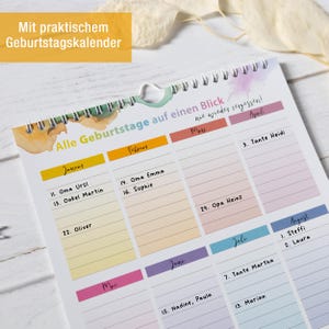 May include: A spiral-bound birthday calendar featuring a white background with colorful monthly headers and lined sections for names and dates. The text reads Alle Geburtstage auf einen Blick nie wieder vergessen, with handwritten names like Oma Ursi and Opa Heinz.