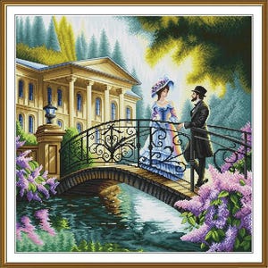 May include: A framed cross-stitch depicting a couple on a bridge in front of a large building. The bridge has ornate ironwork and is surrounded by purple flowers. The couple is dressed in period clothing.