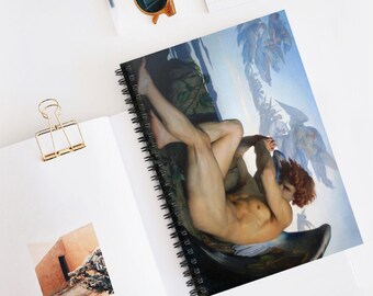May include: A spiral bound notebook featuring a painting of a winged angel with a sorrowful expression. The angel is reclining on a rock with its wings spread out behind it. The background is a blue sky with clouds and other angels flying in the distance.