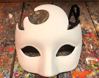 May include: White masquerade mask with a crescent moon design and eye holes. The mask has a black ribbon attached.