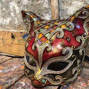 Cat carnival mask decorated with glitter, baroque decorations and harlequin colors - Elegant Venetian party mask