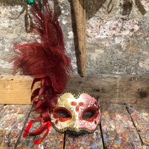 Original Venetian mask for carnival parties with feather and hand decorated by local artisans