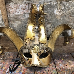 Original Venetian mask for carnival parties as a jester with precious fabric and hand painted by expert craftsmen
