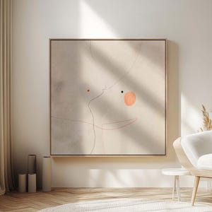 May include: A large, square abstract art piece with a light beige background and a thin, natural wood frame. The artwork features minimalist line drawings in red and black, with a peach-colored circle. The piece hangs in a modern living room setting.