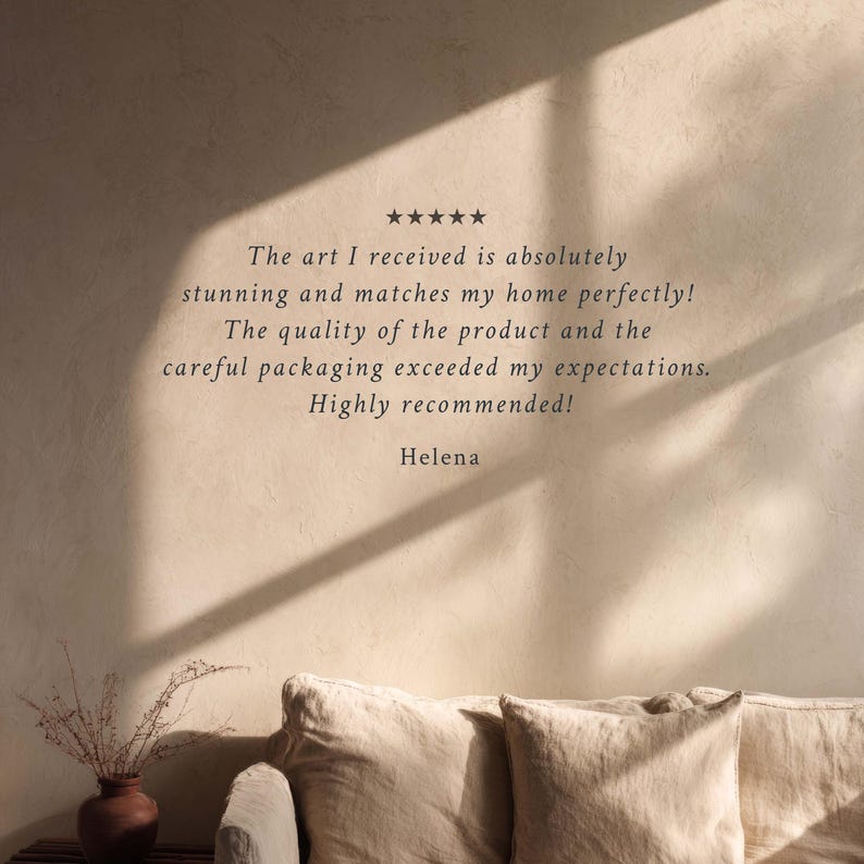 May include: A neutral-toned interior scene featuring a beige sofa with two pillows. The wall displays text: "The art I received is absolutely stunning and matches my home perfectly!" and "Highly recommended!" by Helena.