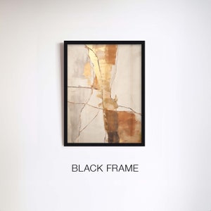 May include: Abstract painting with gold, brown, and white colours on a canvas with a black frame. The painting has a textured look and features a geometric design.