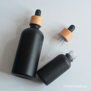 5ml 15ml 30ml 50ml 100ml Matte Black Glass Essential Serum Herb Oil Dropper Bottle, Natural Bamboo Collaer Dropper Pipette Bottle, Wholesale